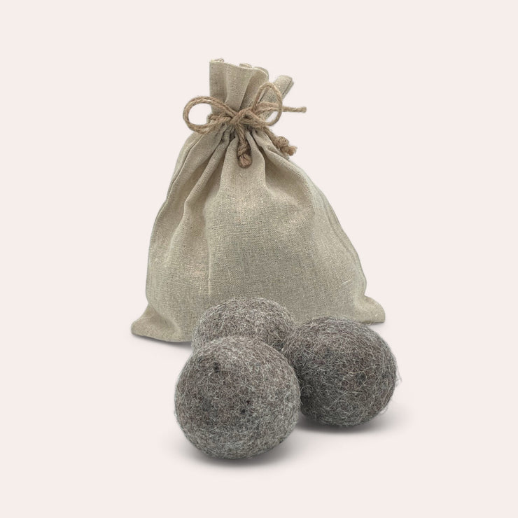 Trio of alpaca wool dryer balls in a linen and hemp bag